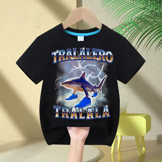 Black t-shirt with a Tralalero Tralala shark graphic and text on a hanger against a beige wall.